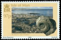 Fossil of Merocanites compressus ammonite on stamp of Isle of Manp 2006