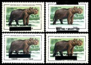 prehistoric animal Uintatherium on surcharged stamp of Madagascar 1998