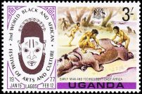 Stone age primitive mans butchering a Hippopotamus on stamps of Uganda 1977