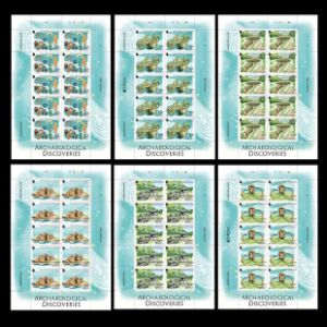 Mammoth skull in between other archeological discoveriess on EUROPA stamps of Jersey 2025