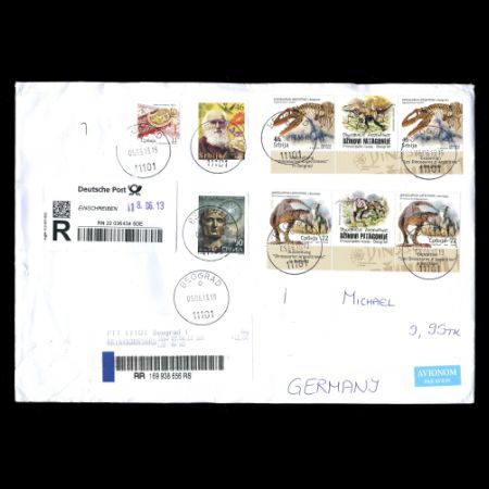 Dinosaurs and Charles Darwin on used cover from Serbia