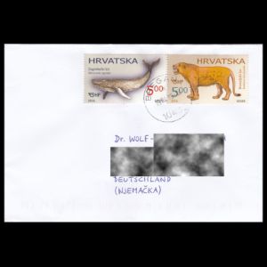 Stamps of prehistoric whale and lion on circulated letter to Germany